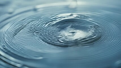Aufkleber - A macro shot of raindrop ripples on a puddle revealing the intricate details and textures of the waters surface.