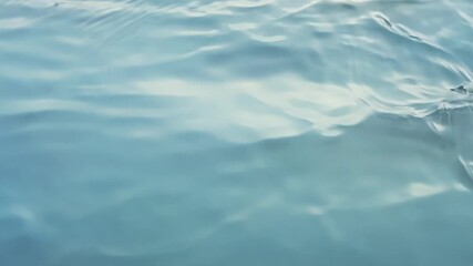 Aufkleber - Soft and gentle ripples cascade across the glassy water surface creating a mesmerizing display.