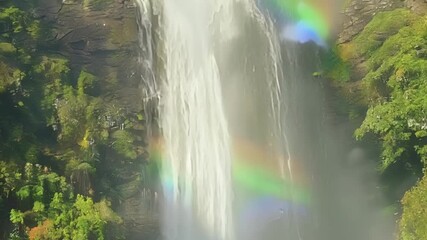 Aufkleber - A mesmerizing view of the waterfall spray as it dances in the sunlight creating a rainbow effect.