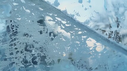 Aufkleber - The window is covered in a delicate frost mosaic with tiny crystals merging together to create a stunning work of art.