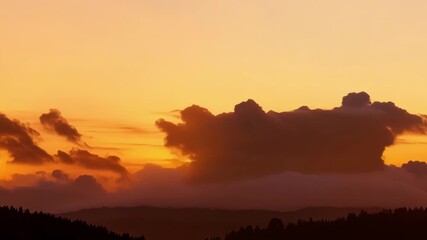 Poster - A zoomedin view of thick billowing clouds moving swiftly across a vibrant sunset backdrop.