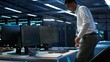 © DC Studio - Data center computer scientist responsible for installation of networking equipment solving tasks. Indian man at work doing maintenance on server room infrastructure, camera B