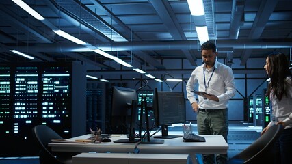 Poster - admin in data center working with colleague to maintaining accurate documentation of equipment, gene