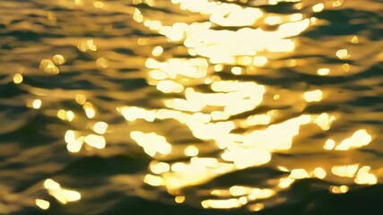 Poster - A zoomedin view of the suns reflection dancing on the rippling ocean surface creating a sparkling magical effect.