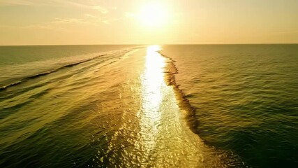 Aufkleber - The suns reflection on the ocean appearing as a trail of glittering gold leading towards the horizon.