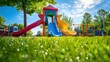 © peeter - A playground with a brightly colored slide and green grass.