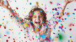 © NooPaew - Excited young girl covered in colorful confetti, enjoying the moment on a white background