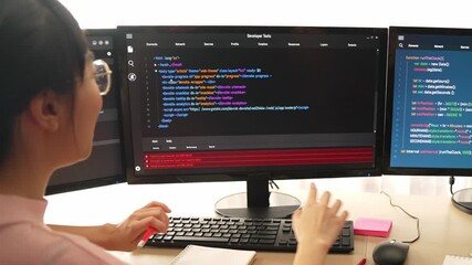 Slow motion back end software developer engineer for computer programming working together on debugging writing computing code, solving complex algorithms display on monitor in office. Burgeoning