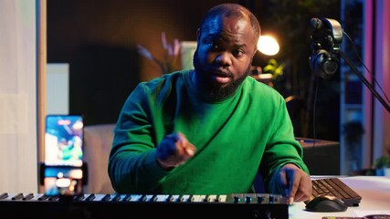 Aufkleber - Famous piano teacher conducting internet master class via vlog tutorial, teaching people how to hit the right notes on electronic keyboard. Young artist performer hosts synthesizer lessons. Camera A.
