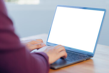 Poster - Mockup image of adult man using and typing on laptop on table in the cafe.