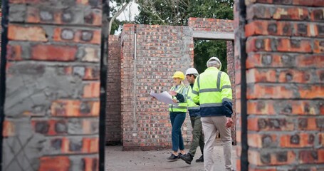 Poster - Engineering, teamwork and people at construction site with floor plan development, renovation or housing project. Builder walking with blueprint in inspection of brick wall, layout or design progress