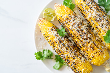 Wall Mural - barbecue and grilled corn with cheese and lime