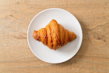 Wall Mural - fresh croissant on white plate