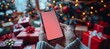 © Elena - Man shopping online with smartphone mockup for christmas gift, red screen, festive background