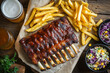 © Jackson Photography - Rack of baby ribs with french fries and barbecue sauce