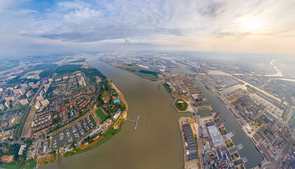 Wall Mural - Antwerp, Belgium. Panorama of the city. River Scheldt (Escout). Summer morning. Aerial view