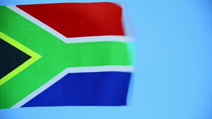 Wall Mural - South Africa flag waving on blue background