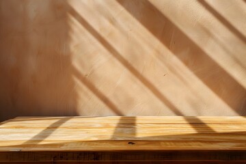 Wall Mural - Close-up of a table with soft shadow on beige background for product display or presentation mockup