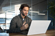 © insta_photos - Busy male support service operator talking to customer sitting at desk. Young professional business man call contact center agent wearing headset working in business office using laptop computer.