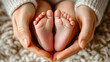 © Oksana_Latysheva - Baby's feet are being held in a mother's hands