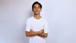 © ferrys - handsome asian young man wearing white shirt crossed hands gesture