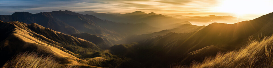 Wall Mural - the sun is setting over the mountains, casting a warm glow over the landscape