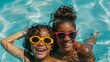 © Zainab - Mother and daughter enjoy a summer afternoon in a swimming pool, both wearing sunglasses and smiling. Their playful interaction and shared fun capture the essence of a family vacation