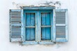© Digital ArT - A blue window in the center and a white wall. Traditional greek architecture