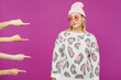 © ViDi Studio - Young confident lesbian woman she wears pink animal clothes, many shaming fingers point on ignoring girl isolated on plain purple background studio portrait. Pride day June month love LGBTQ concept.