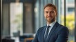 © Andrii  - Polished Executive in Business Attire at Office Desk
