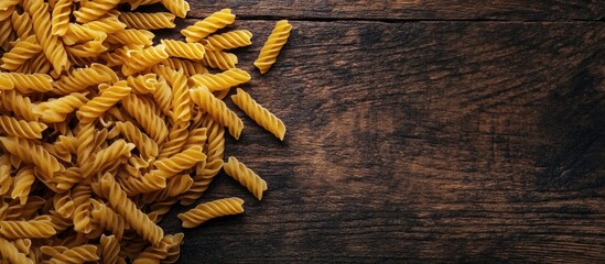 Poster - Dry pasta Viewed from above On a wooden surface Free copyspace