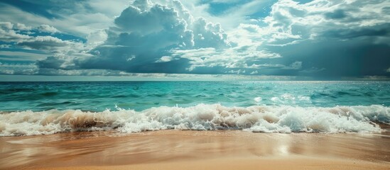 Poster - The sandy shore is lined with waves under a cloudy sky with an available copy space image of the sea