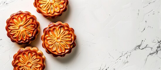 Poster - Top view of a traditional moon cake on a white background a round pastry common in Vietnamese and Chinese mid autumn festivals with a clipping path for copy space image