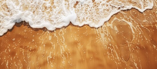 Poster - Top view of sandy beach providing a textured background with ample copy space image