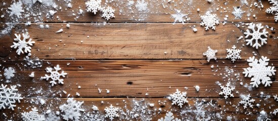 Fototapete - Winter sale on a wooden table adorned with snowflakes providing a festive and inviting copy space image for text placement