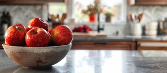 Poster - Fresh apples in a bowl displayed on a kitchen counter with copy space image