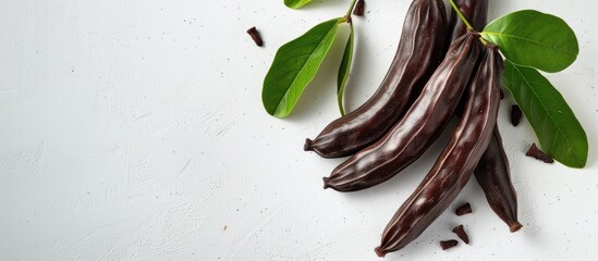 Aufkleber - Ripe carob on a white backdrop with copy space image