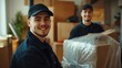 © The Little Hut - Portrait of a two young smiling male movers packing furniture in the living room Moving service men workers wrapping chair with plastic wrap Move moving day and relocation concept : Generative AI