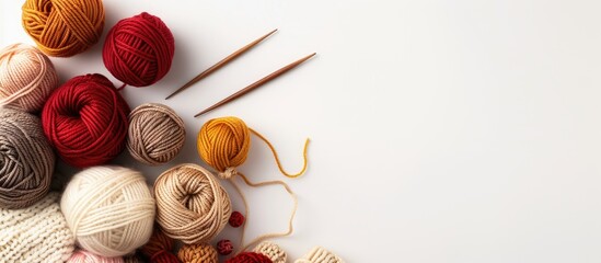 Poster - Various types of wool yarn wooden knitting tools and yarn balls on a white background for needlework and DIY projects with a copy space image