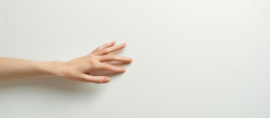 Aufkleber - A woman s hand on a blank white surface with copy space image