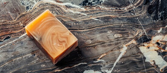 Poster - Handcrafted organic soap on wooden surface with marble pattern and copy space image