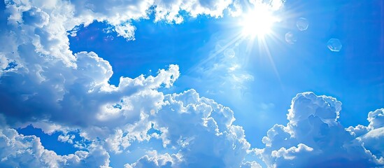 Poster - Sunny day with a blue sky adorned by fluffy white clouds ideal for a design background Perfect for wallpapers or web banners featuring a copy space image