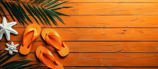 Wall Mural - Summer holiday concept with flip flops on a wooden background in a flat lay setting showcasing a serene vibe with copy space image available