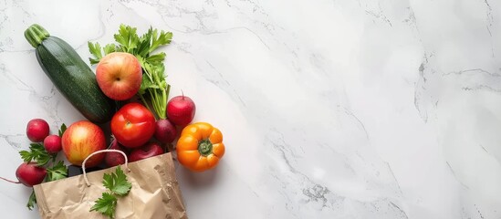 Sticker - Various fresh vegetables and fruits in a paper bag arranged on a white marble surface for a vegan food delivery ideal for adding text alongside the copy space image