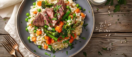 Poster - Risotto with steak and mixed vegetables perfect for a dinner entree featuring a copy space image