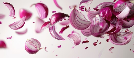 Poster - Red onion slices falling with copy space image on white backdrop