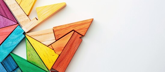 Poster - Colorful wooden tangram puzzle on a white background with a clear space for an image. copy space available