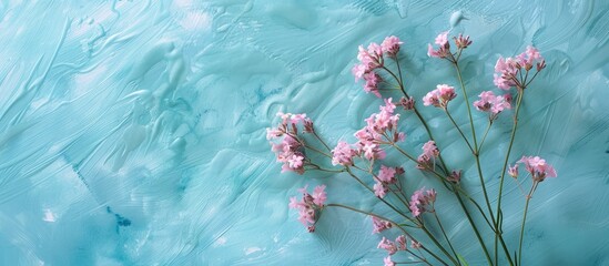 Poster - Wavyleaf sea lavender also called Limonium sinuatum displays sea pink flowers against a blue watercolor backdrop with a blank card in the copy space image