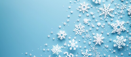 Poster - Holiday theme with white snowflakes on a blue backdrop Aerial perspective with a flat layout design and frame for a copy space image