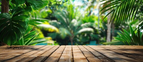 Aufkleber - A summer resort themed composition with a brown wooden floor and vibrant green leaves in the foreground offering ample copy space image